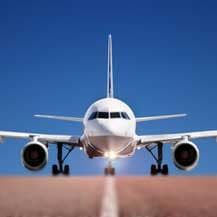 plane on runway, big blue sky above