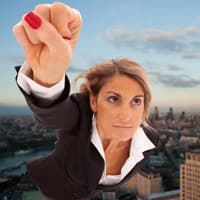 Woman in business attire flying like a superhero