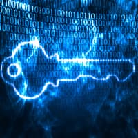 Image of a key in front of business data