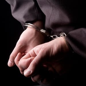 Businessman in handcuffs