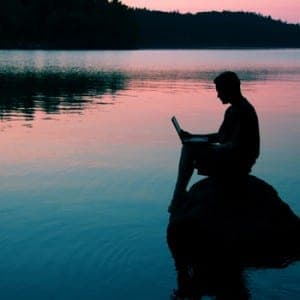 Man on computer in beautiful surrounds