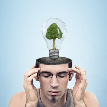 Man with lightbulb above head