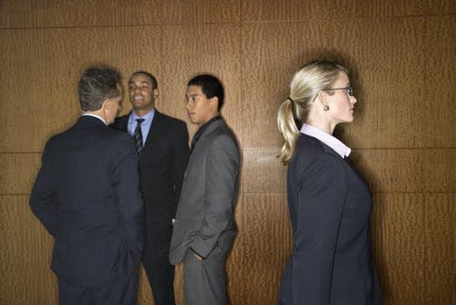 group of men talking with woman on outside